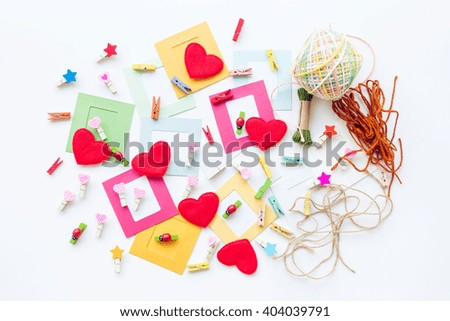 Paper photo frame with decoration over white table background