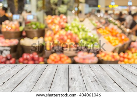 Empty Wood plank on blurred market fruit