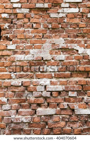   photographed close-up of an old crumbling brick wall of the building