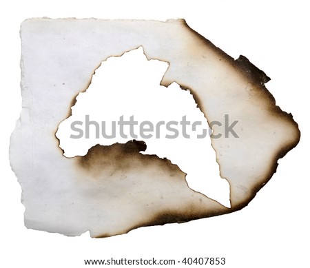 burnt hole in a paper isolated on white