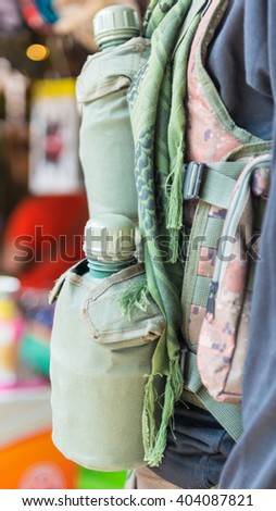 Army water canteen with desert cover on a soldier.