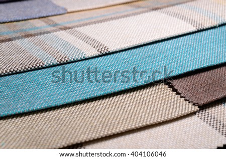 Bright collection of colorful gunny textile samples. Fabric texture background Royalty-Free Stock Photo #404106046