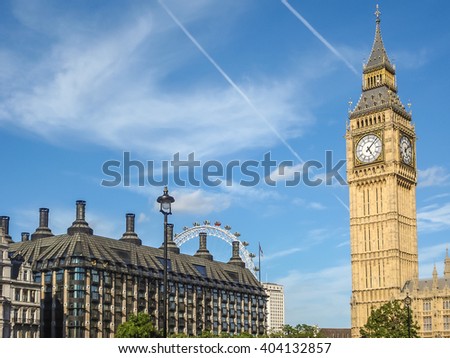 Big Ban Elizabeth tower clock face, Palace of Westminster and London Eye in background, London, UK Royalty-Free Stock Photo #404132857