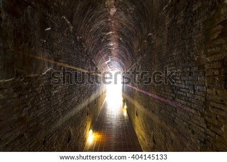 Walkway tunnel made by red brick and middle white isolated space for text or design