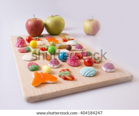 marmalade and candies on a wooden board in a row