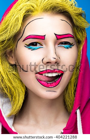 Photo of surprised young woman  with professional comic pop art make-up. Creative beauty style. 
