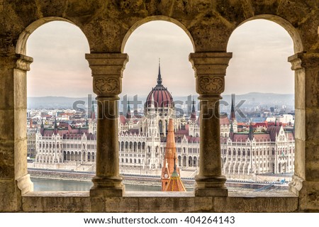 Budapest,  Parliament view through Fishermans Bastion, Hungary Royalty-Free Stock Photo #404264143
