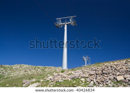 summer view of ski lift under a deep blue sky. Photo taken with polarized filter
