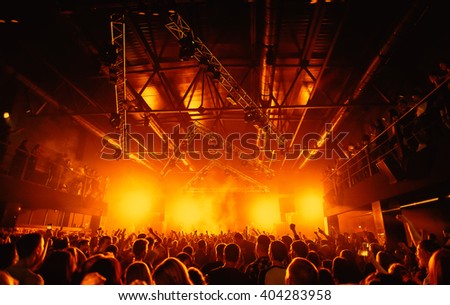 night party festival crowd of people silhouettes hands up Royalty-Free Stock Photo #404283958