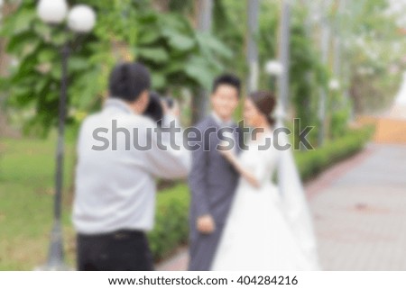 Blurred image of wedding photographer in action