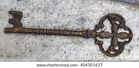 bronze key old on Marble background stone surface