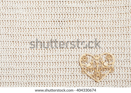 Wood heart on knitted fabric
