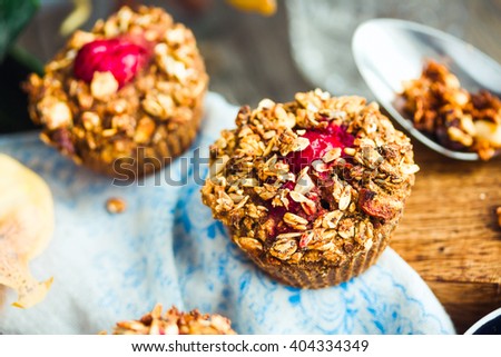 vegan oat muffins with cherries and granola, healthy dessert, pastry Royalty-Free Stock Photo #404334349