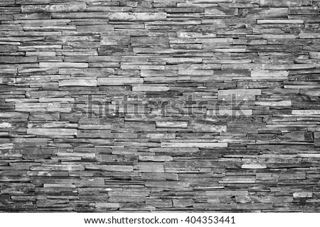 pattern of decorative slate stone wall surface Royalty-Free Stock Photo #404353441
