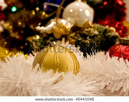gold christmas ornaments with christmas lights on christmas time