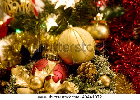 gold christmas ornaments with christmas lights on christmas time