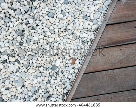 Pebble sea Stone texture with wood Royalty-Free Stock Photo #404461885