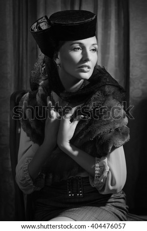 Beautiful young actress in classic 20s interior