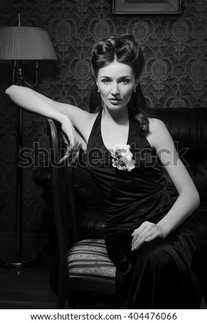 Beautiful young actress in classic 20s interior