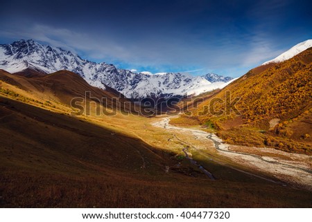 Fantastic view of the alpine valley at the foot of Mt. Shkhara. Dramatic scene. Location famous resort Ushguli, Upper Svaneti, Georgia, Europe. High Caucasus ridge. Artistic picture. Beauty world.