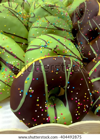 Donuts. Sweet icing sugar food. Dessert colorful snack. Glazed sprinkles.