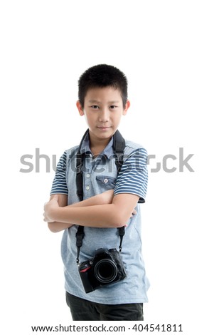 Asian boy holding camera on white background.
