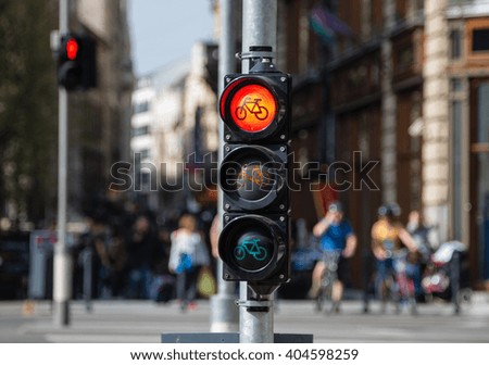 Bicycle riders waiting for traffic light sign to allow crossing street