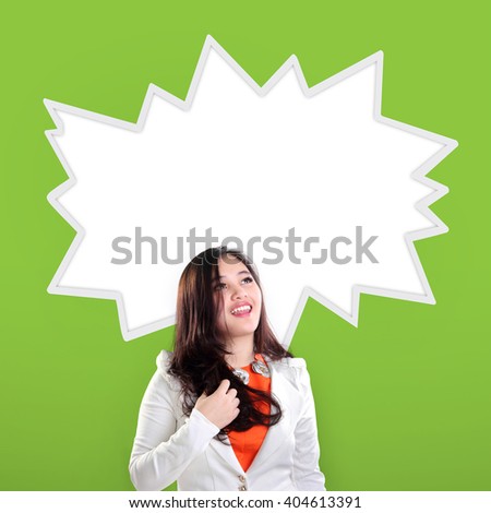 Happy excited Asian businessman woman looking up at empty comic splash, over green background