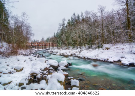 A picture of a river in the winter condition.  The location is Mt.Hood National Forest, near Portland, Oregon, USA