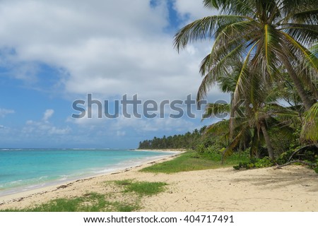 Wonderful sandy beach as background for traveling in blue, green and turquoise colors.