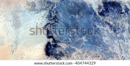 stone head, abstract photography of the deserts of Africa from the air. aerial view of desert landscapes, Genre: Abstract Naturalism, from the abstract to the figurative, contemporary photo art