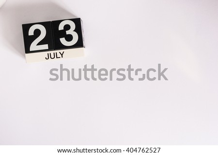 July 23rd. Image of july 23 wooden color calendar on white background. Summer day. Empty space for text. National Hot Dog Day. World Whale and Dolphin DAY