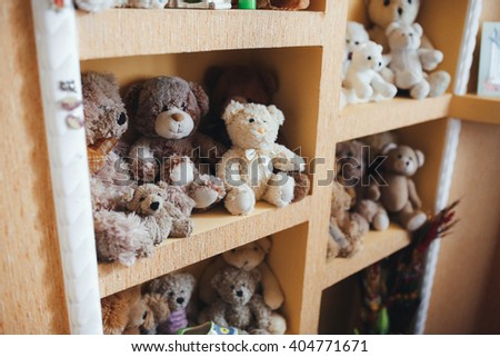 A lot of teddy bears on the shelves