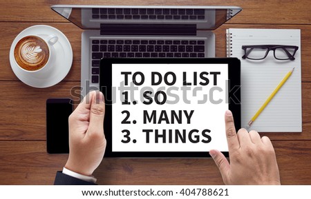 To Do List - So Many Things , on the tablet pc screen held by businessman hands - online, top view