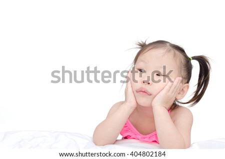 Little Asian girl thinking over white background