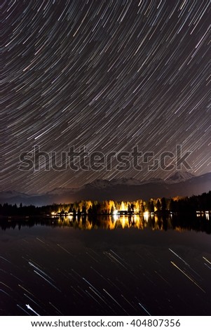 Star trails reflected by a lake in southern Canada