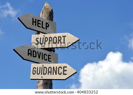 Wooden signpost with four arrows - "help, support, advice, guidance". Great for topics like customer support, assistance, business presentations etc. Royalty-Free Stock Photo #404833252