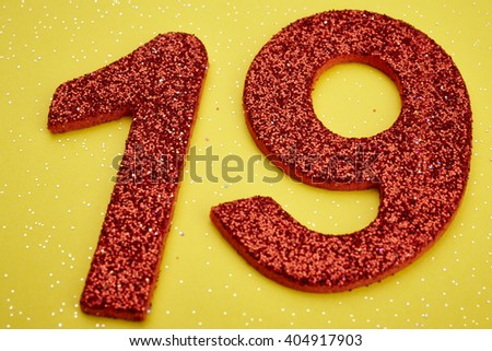 Number nineteen red color over a yellow background. Anniversary. Horizontal
