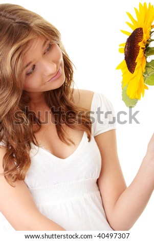 Gorgeous teenage female  holding yellow sunflower over white background