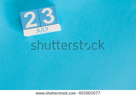 July 23rd. Image of july 23 wooden color calendar on blue background. Summer day. Empty space for text. National Hot Dog Day. World Whale and Dolphin DAY