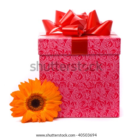 Orange gerber flower and gift box on white background