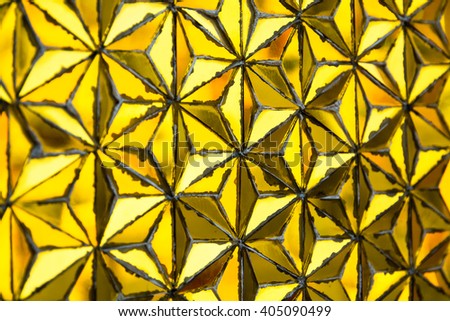 Gold texture with mosaic pattern in Wat Traimit. Bangkok, Thailand. Selective focus