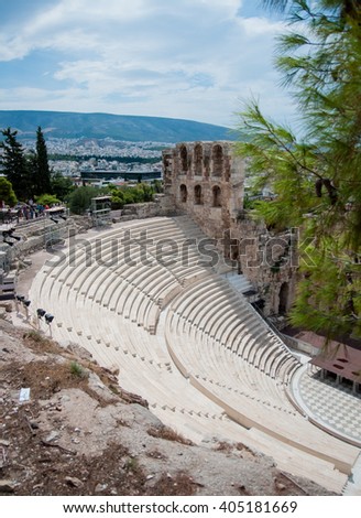 Picture of a rebuilt ancient Greek theatre with the Athens cityscape on the background