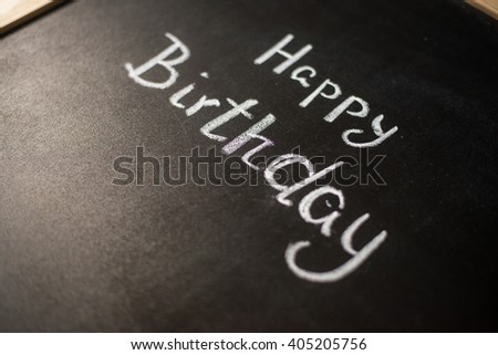 happy birthday title drawn with chalk on the blackboard