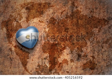 heart with national flag of argentina on a vintage world map crack paper background. concept