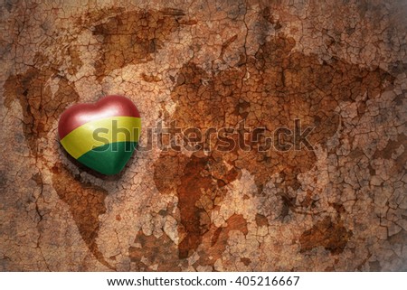 heart with national flag of bolivia on a vintage world map crack paper background. concept