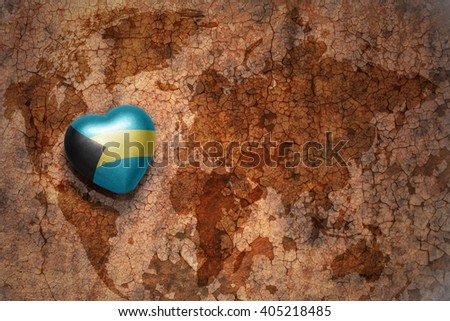heart with national flag of bahamas on a vintage world map crack paper background. concept