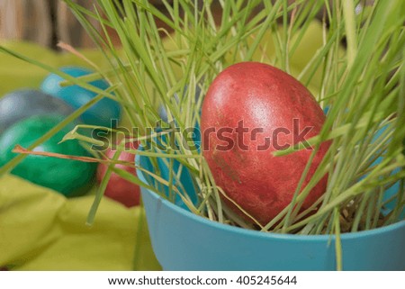 Easter colored eggs in a colorful pot