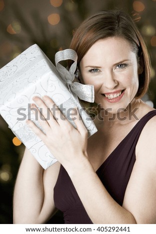 A woman holding a present