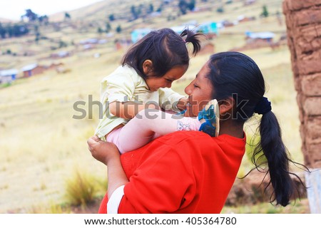 Happy aymara family Royalty-Free Stock Photo #405364780